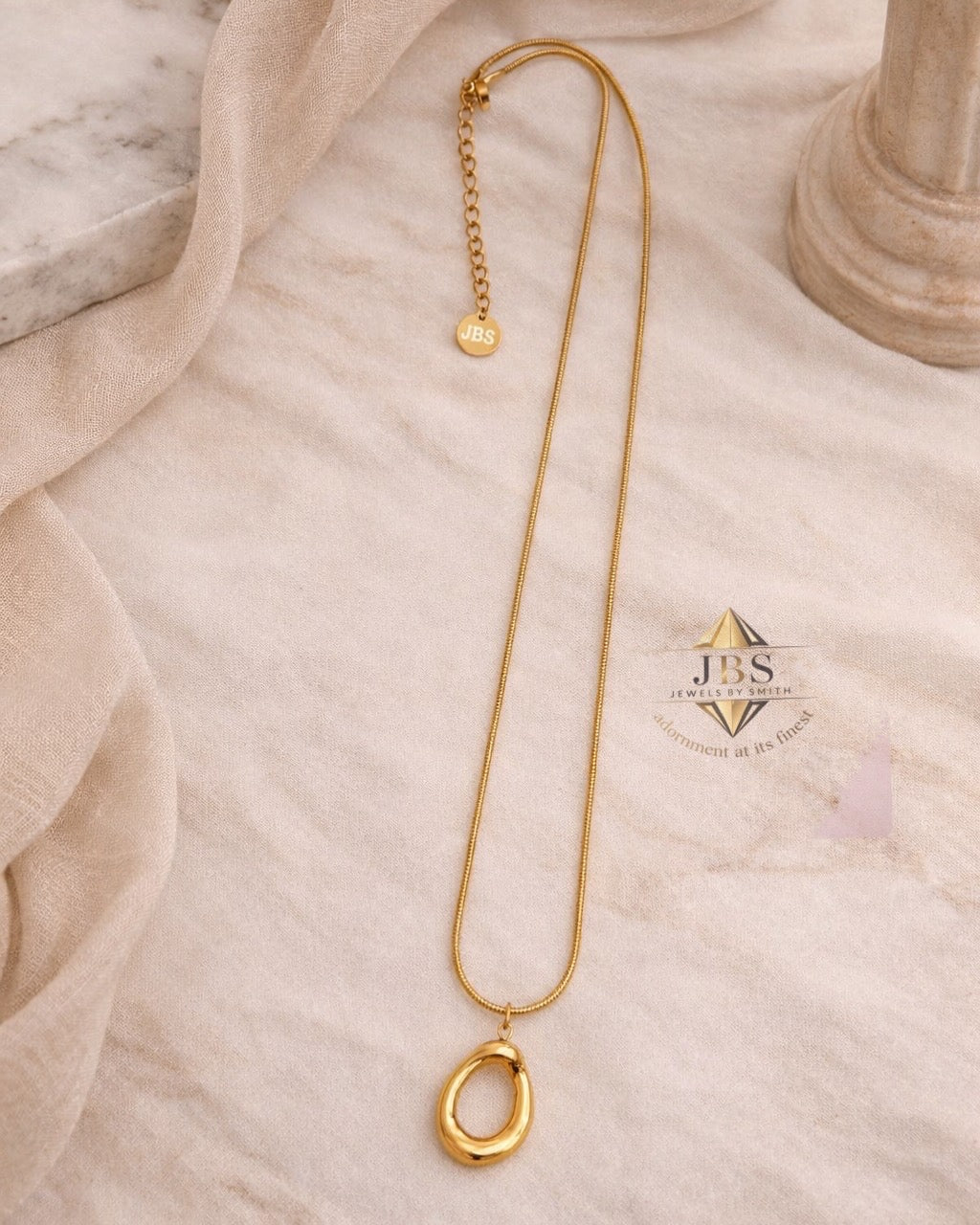 Halo Pendant Necklace non-tarnish waterproof gold pendant in stainless steel displayed on clean flat surface 