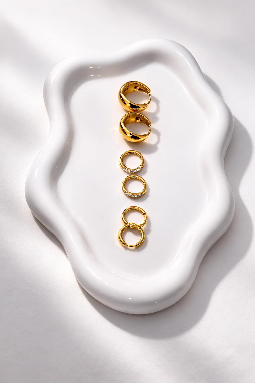 Luma Huggies non-tarnish waterproof gold hoop earrings in stainless steel